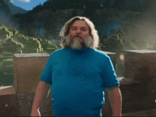 a man with a beard wearing a blue shirt says i am gay