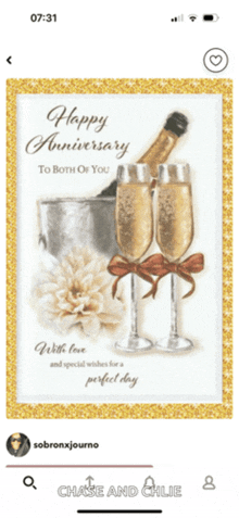 a phone screen shows a happy anniversary to both of you card