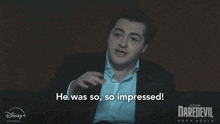 a man in a suit and white shirt says he was so impressed