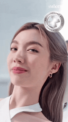 a woman 's face is shown with a recommended by dermatologist badge