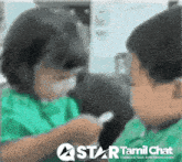 a boy and a girl are looking at each other with a star tamil chat logo in the corner