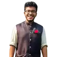 a young man wearing glasses and a vest is smiling with a red rose in his pocket .