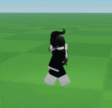 a person in a black and white outfit is running through a field .