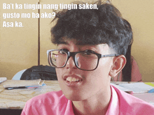 a young man wearing glasses and a pink shirt with a caption that says " ba 't ka tingin nang tinginsaken "