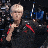 a man wearing glasses and a jacket with the word samsung on it
