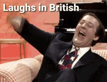 Laughs In British Britain GIF - Laughs In British Britain British GIFs