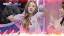 a girl in a purple sweatshirt with a name tag that says ' hyun ' on it