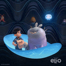 a poster for the movie elio shows a boy holding a popcorn box and a monster