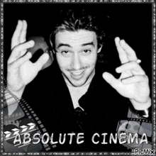 a black and white photo of a man with absolute cinema written on the bottom