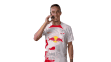 talking with someone yussuf poulsen rb leipzig calling on the phone dialing someone
