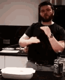 a man is standing in front of a bottle of jack daniel 's