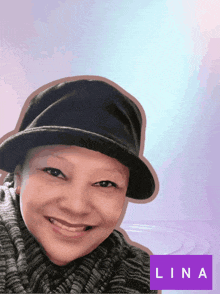 a woman wearing a hat and a sweater with the name lina on the bottom right
