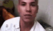 a close up of a man 's face with his eyes closed .