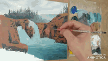 a painting of a waterfall is being painted by a person