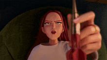 a woman with red hair is holding a pair of scissors and making a funny face .