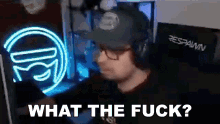 a man wearing a hat and headphones is asking what the fuck