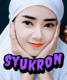 a picture of a woman with the name syukron on the bottom right