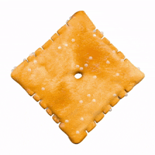 a cracker with a hole in the middle and sprinkles on it