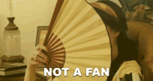 Not A Fan Fan GIF - Not A Fan Fan Hiding GIFs