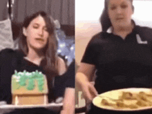 a woman is holding a plate of food next to a cake