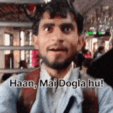 a man with a beard is on a bus and says haan mai dogla hu