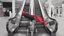 Escalator Ride Hes Back Hes Deadpool GIF
