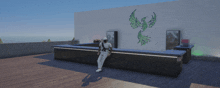 a man sits at a bar with a green phoenix on the wall