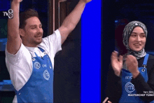 a man and a woman wearing aprons that say masterchef turki