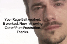 a man with a beard is crying with tears coming out of his eyes .