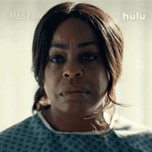 a woman in a hospital gown with a hulu logo on the bottom