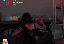a woman is laying on a couch with the words wait that opens written above her
