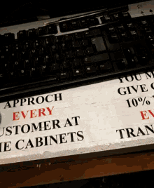 a sign that says approach every customer at their cabinets