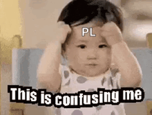 a baby is making a funny face while holding his hands to his head and saying `` this is confusing me '' .