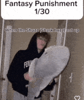 a man holding a stuffed shark with the caption fantasy punishment 1/20 when the shuzz ( shark huzz ) act up