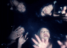 a group of women are posing for a picture with their faces visible