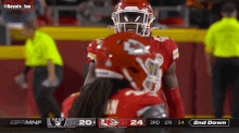 a football player in a red uniform with the number 24 on his helmet