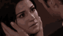 a close up of a man 's face looking at a woman