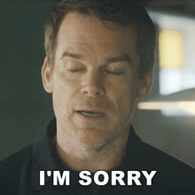 a man says i 'm sorry in front of his face