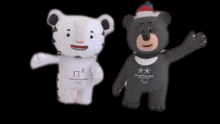two stuffed animals one of which is a tiger and the other is a bear