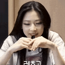 a woman with korean writing on her t-shirt