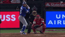 a baseball player with the number 5 on his jersey is swinging at a pitch