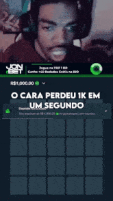 a man wearing headphones is playing a game on a jon bet website