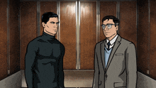 two men in suits are standing in an elevator