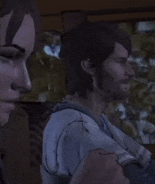 a man and a woman are sitting next to each other in a video game