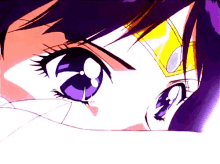 a close up of a girl 's eyes with purple and blue