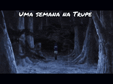 a man in a blue shirt is walking through a dark forest with uma semana na trupe written on the bottom