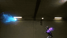 a person is standing in a dark room with purple and blue lights coming out of the ceiling