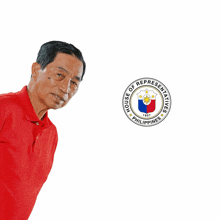 a man in a red shirt is standing in front of a house of representatives seal