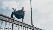 a man is jumping off a bridge with the hashtag pranay_varma on the bottom