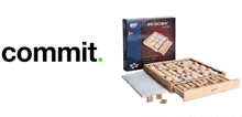 a wooden sudoku game in a box with a drawer and a bag .